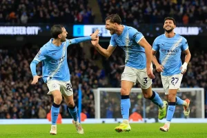 uben Dias celebrates with his Manchester City teammates